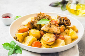 Roasted potato and carrot with lemon, garlic, spicy dressing. Selective focus, space for text.