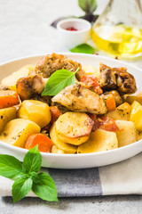 Roasted potato and carrot with lemon, garlic, spicy dressing. Selective focus, space for text.