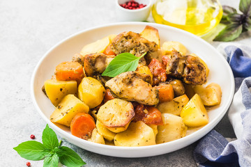 Roasted potato and carrot with lemon, garlic, spicy dressing. Selective focus, space for text.