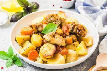 Roasted potato and carrot with lemon, garlic, spicy dressing. Selective focus, space for text.