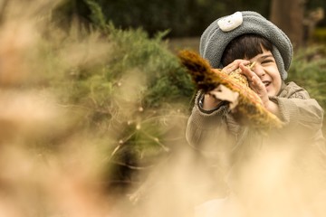 Kid  Playing in nature with broom