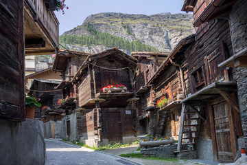 Back street with old wooden barns and shed, Zermatt, Switzerland