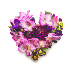 Heart of gladiolus and dahlias flowers on a white background