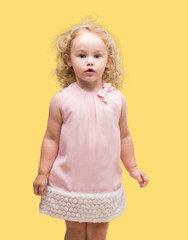 Beautiful blonde toddler gesturing