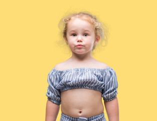 Beautiful blonde toddler gesturing