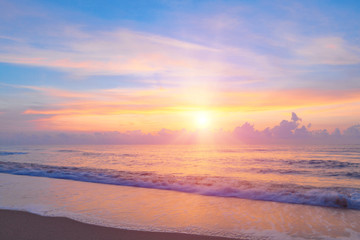 Bright sunrise or sunset  over the beach an impressive