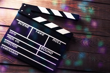 Clap board on wooden background