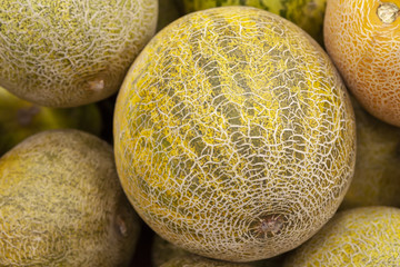 Fresh juicy melon on the counter of the store. View from above.