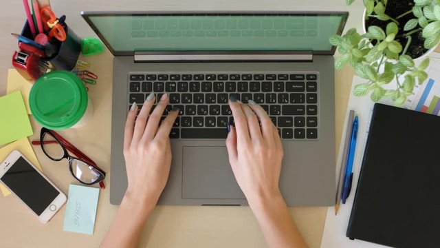 Top view of businesswoman typing keyboard and working on laptop computer