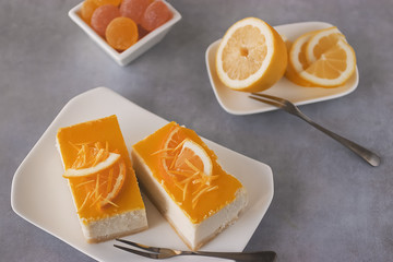 Fototapeta na wymiar Homemade orange and lemon cheesecake.