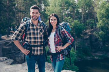 Eco tourism. Two trendy stylish people, spouses on vacation, tra