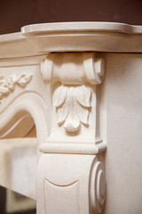 Carved white marble corbel bracket with acanthus leaf on fireplace column pilaster detail © Olexandr Tytarchuk