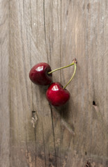 Isolatrd cherries on a wood table