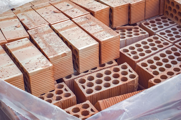 Obraz na płótnie Canvas Close-up stacks of red brick