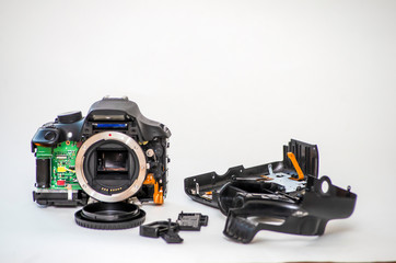 Fototapeta premium Repair of a broken digital SLR camera 