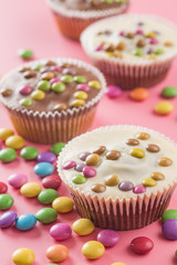 Sweet cupcakes with candies.