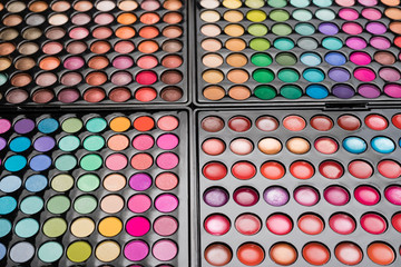 Makeup background made of eyeshadow palettes