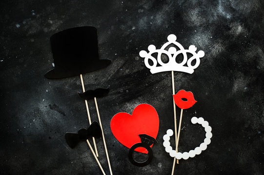 Photo booth props mustache, crown, lips on black board background. Birthday and Party Set and wedding.
