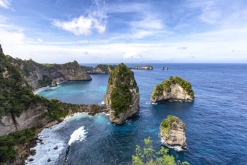 Fototapeta premium View of the small islands of Nusa Batumategan and Nusa Batupadasan from the Raja Lima shrine on Nusa Penida Island near Bali, Indonesia.