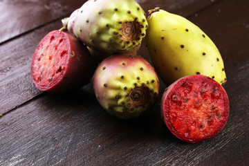 Fruits of the prickly pear cactus on a rustic table.