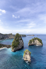 Fototapeta na wymiar Raja Lima or Five Kings, islands off the coast of Nusa Penida near Atuh Beach.