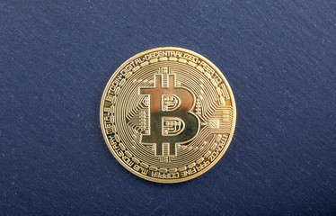 golden bitcoin in a woman hand, symbol of a crypto-currency, concept business and finance