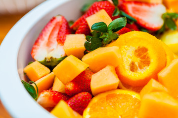Fototapeta na wymiar Closeup of Cut Fruit in a Fresh Mixed Fruit Salad
