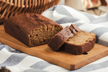 Pumpkin loaf cake on rustic wooden board