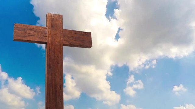 wooden cross on the blue sky cloudy footage background