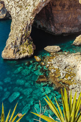 Tropical water in Malta. Landcape, rocks, sea, and plants
