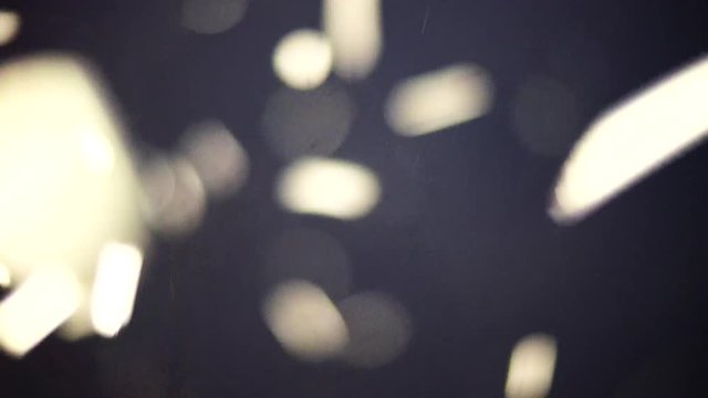 Thousands of swarming flying insects. Abstract background of many mosquitoes flying around at night in bright light. Mating Mayflies swarming near the water for mating. 3d deep particles.