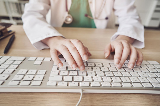 Female health worker using computer