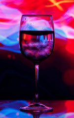 Wine glass on colourful background