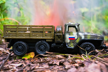 Burning of a russian military toy truck. Imitation of unexpected attack.
