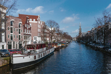 Boats and Houses along a Canal in Amsterdam, the Netherlands