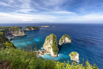 Beautiful wide angle landscape view of Raja Lima islands near Atuh Beach in Nusa Penida.