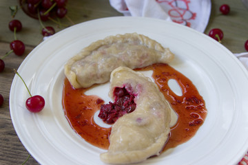 Stuffed cherry dumplings, delish dessert with herbs.