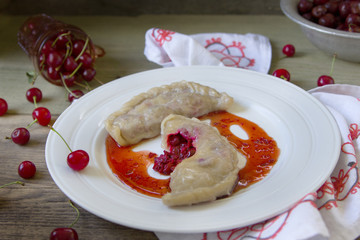 Stuffed cherry dumplings, delish dessert with herbs.