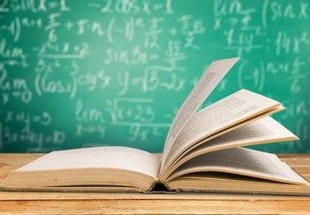 Maths formulas written by  chalk on the blackboard background.