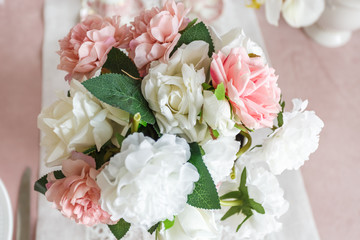 bridal bouquet of white and pink peonies and roses