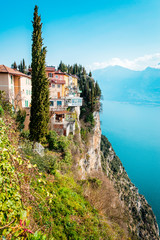 The cliffs of Tremosine sul Garda, view to the balconies at the cliffs next to the abyss, in the background Lake Garda, Italy