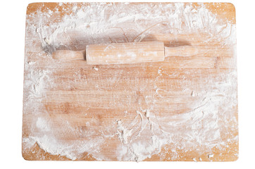 Rolling pin on a wooden tray covered with flour isolated on white background