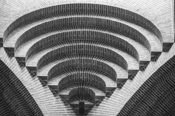 Circle lines at the top of a church making an amazing brick textured pattern like a spiral going to the infinite