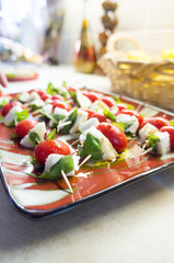 Caprese on skewer in plate