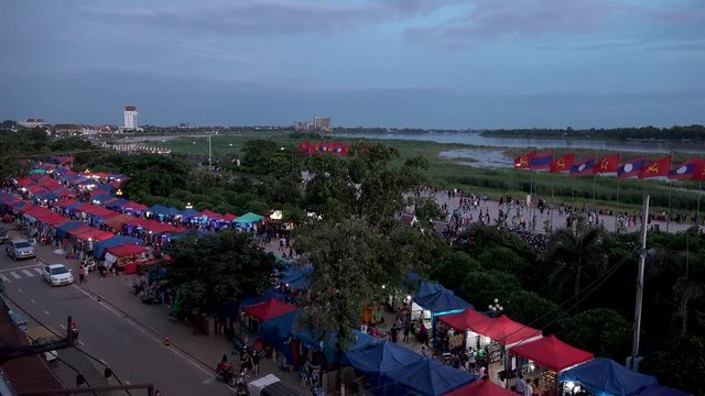 Scenery of NIGHT MARKET and MEKONG RIVER.  In fast motion, day to night.