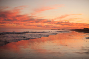 Fototapeta na wymiar Sunset at Ocean and Beach