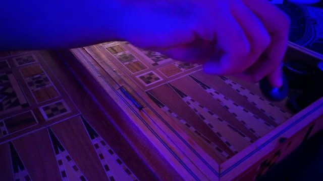 people playing backgammon -  traditional oriental game