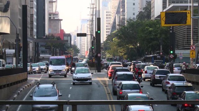 Traffic passes into and underpass in downtown Sao Paulo during rush hour