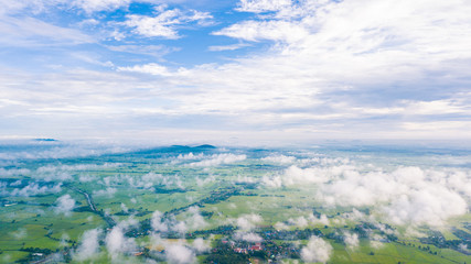 Fototapeta premium Aerial view of Cloudy sky high above the earth