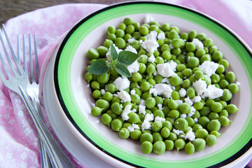 Fresh salad of green peas, goat cheese and herbs.
